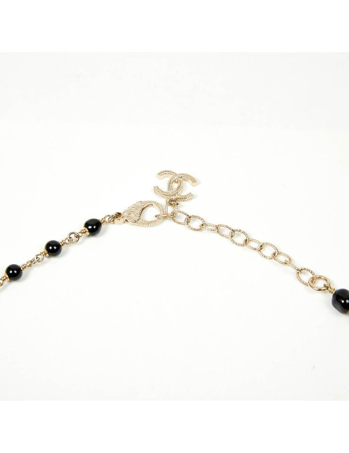 Sautoir CHANEL chaîne dorée et perles noires
