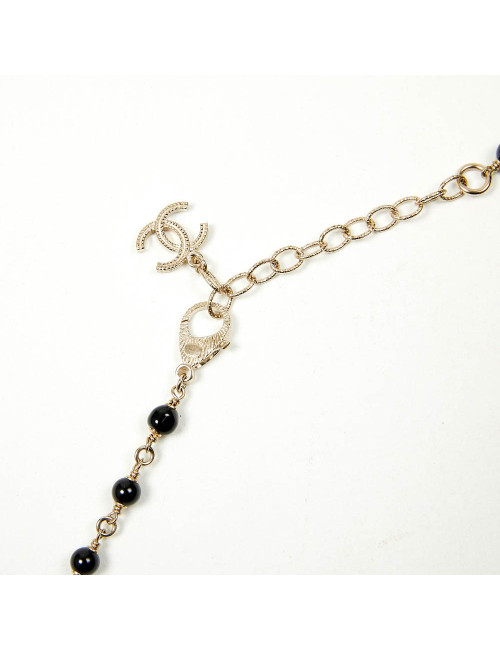 Sautoir CHANEL chaîne dorée et perles noires