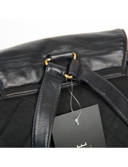 Sac a dos vintage CHANEL en toile et cuir bleu marine