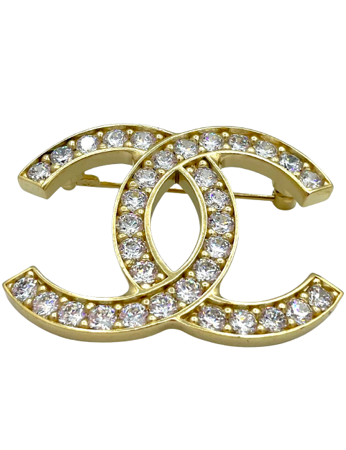Broche CHANEL dorée et strass