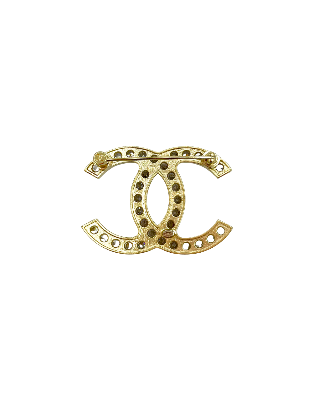 Broche CHANEL dorée et strass