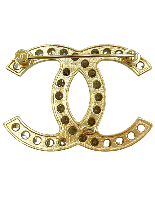 Broche CHANEL dorée et strass