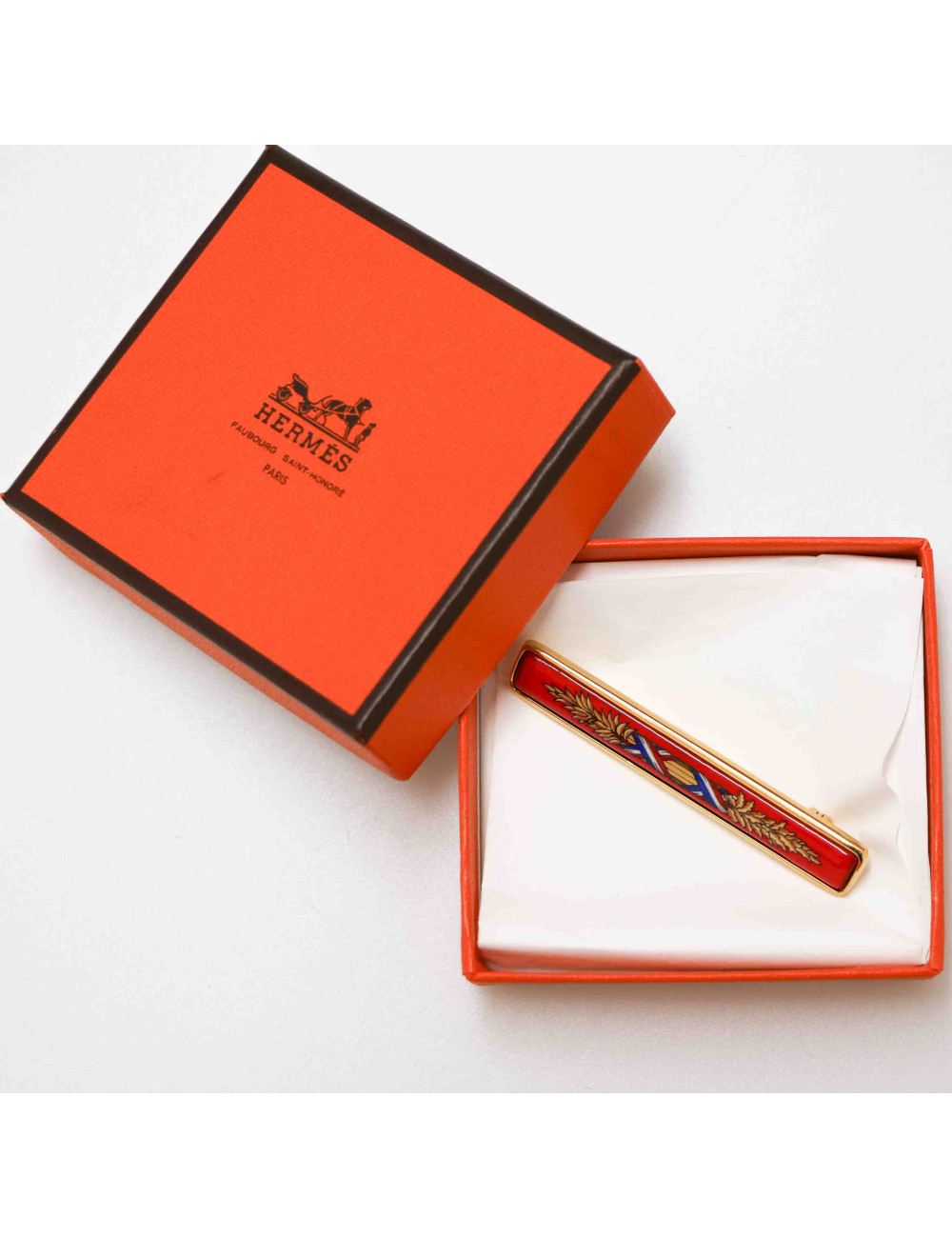 HERMES red enameled brooch