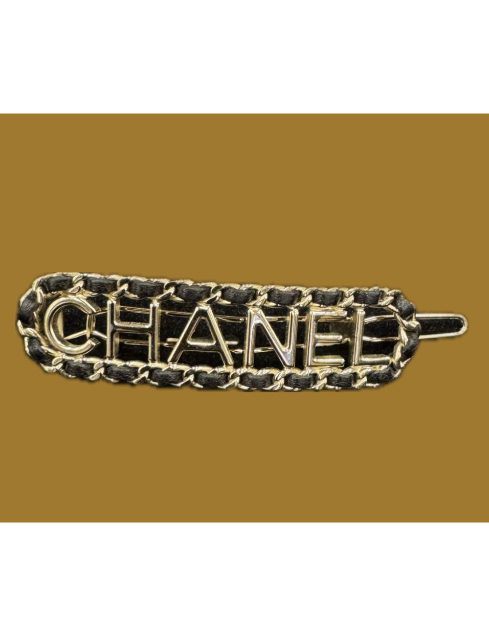 Barrette Chanel cuir et métal doré