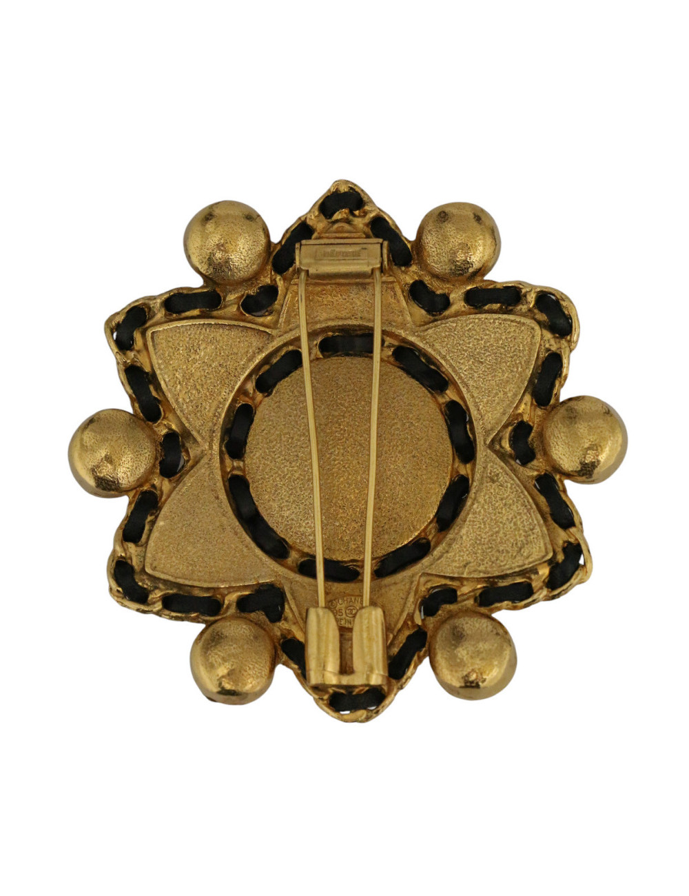 Broche étoile Chanel pâte de verre et cuir