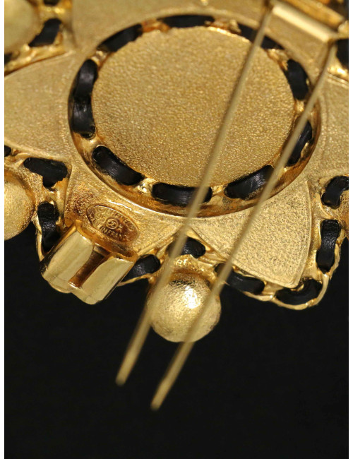 Broche étoile Chanel pâte de verre et cuir