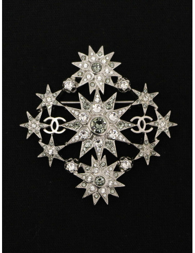 Broche Chanel étoiles métal argent et strass