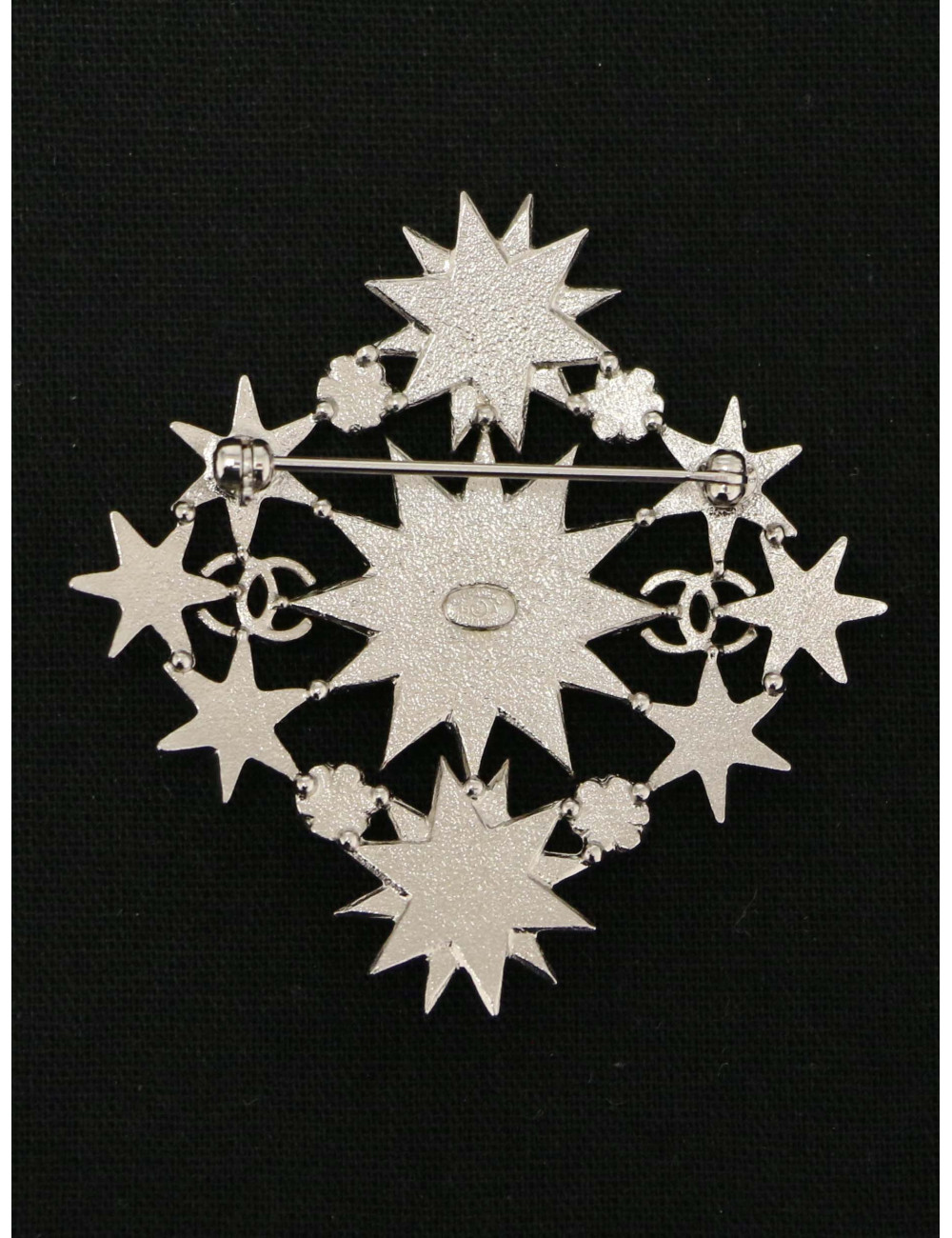 Broche Chanel étoiles métal argent et strass