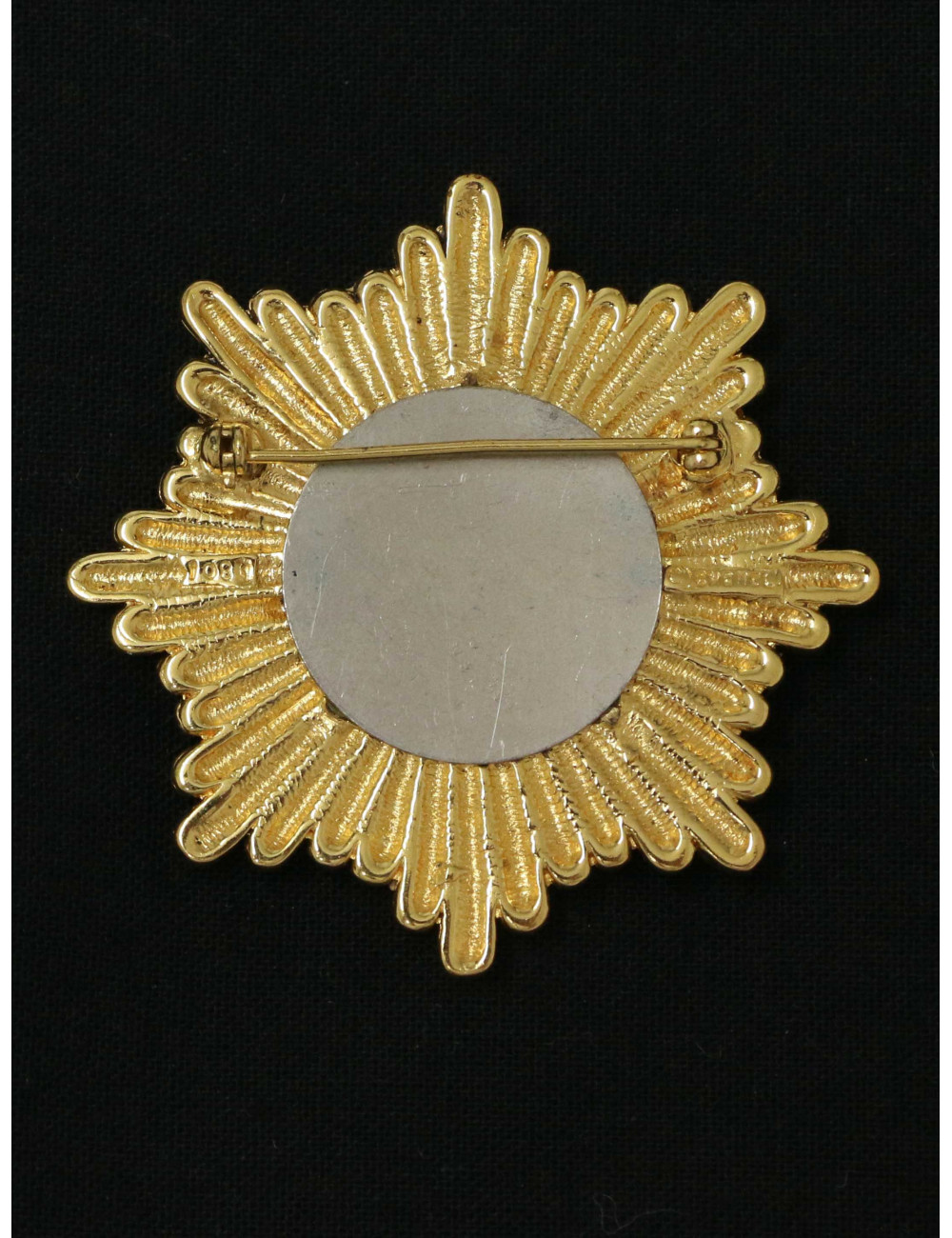 Broche Chanel starbust dorée Vintage 1983