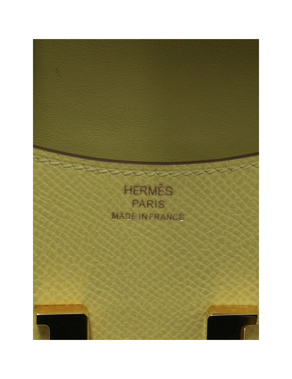 Porte monnaie Constance HERMES cuir Epsom jaune
