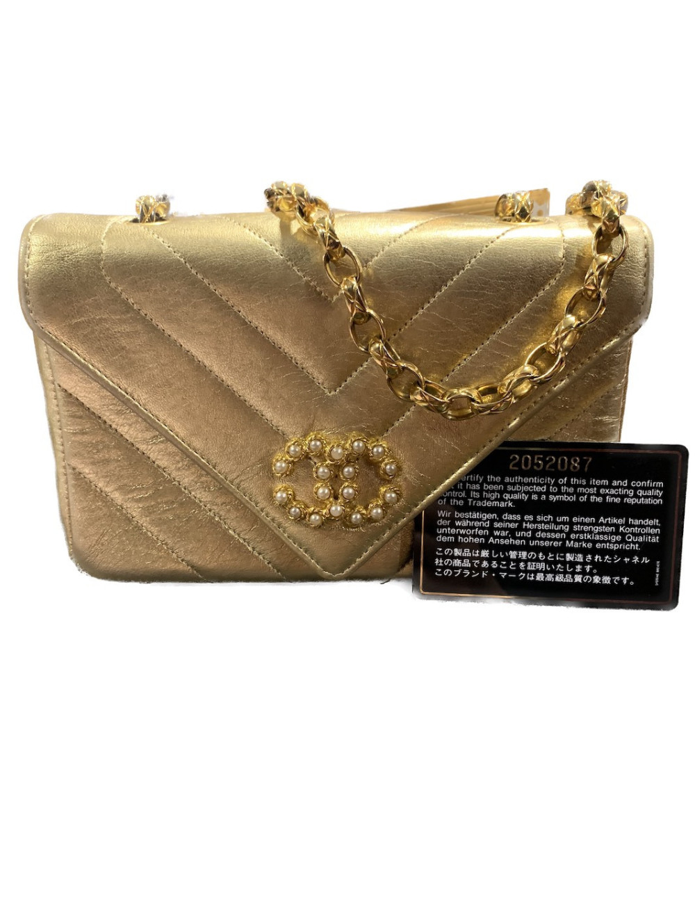 Sac du soir Chanel cuir doré chevrons