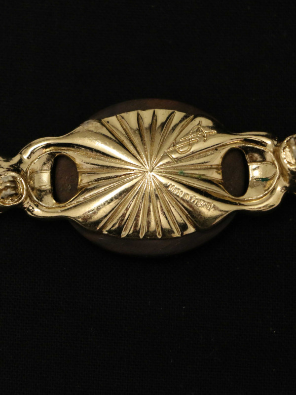 Broche métal ébène YSL par Goossens