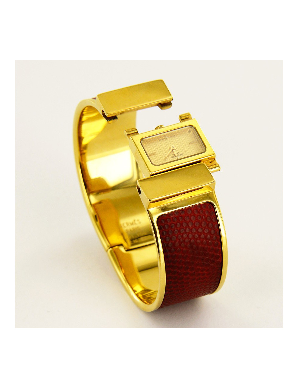 Montre Loquet HERMES  serpent rouge dorée