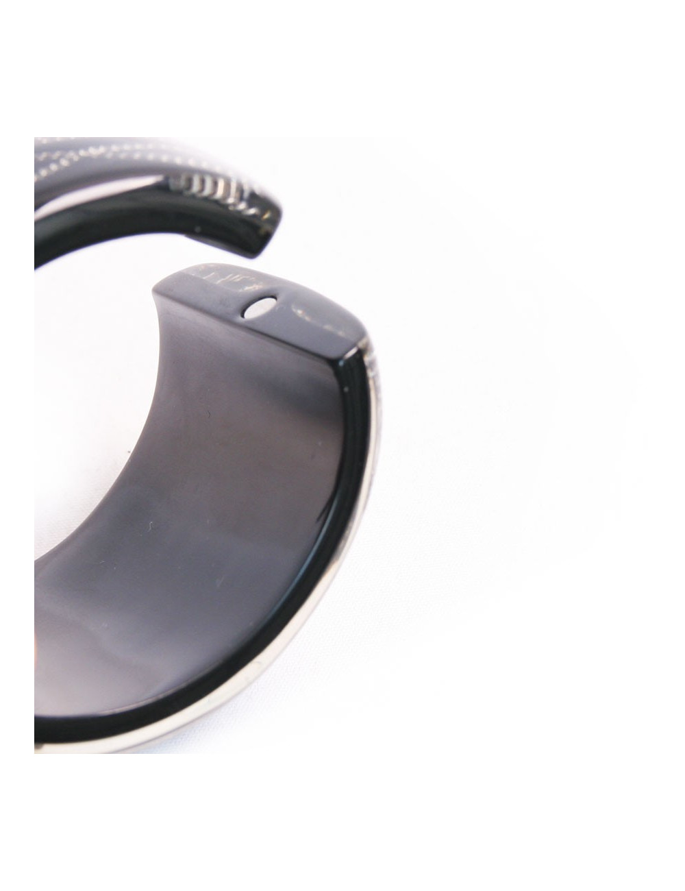 Manchette CHANEL noire avec inclusion chaînes et brillants