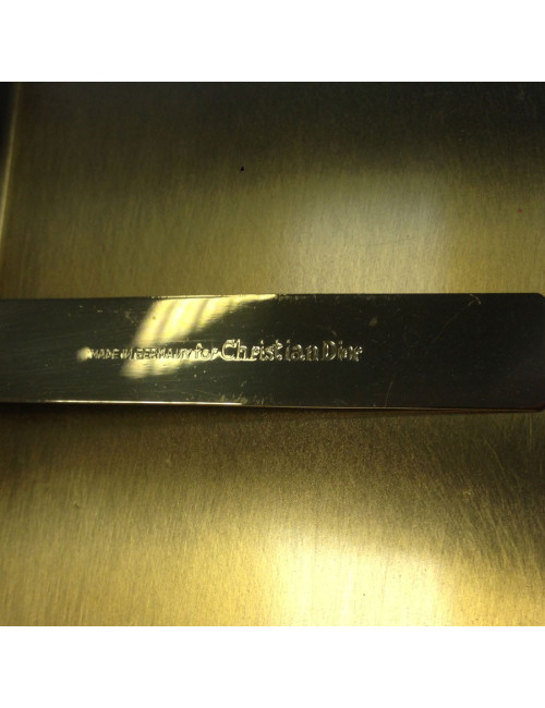 Door-mini cigarettes and his CHRISTIAN DIOR metal comb gold