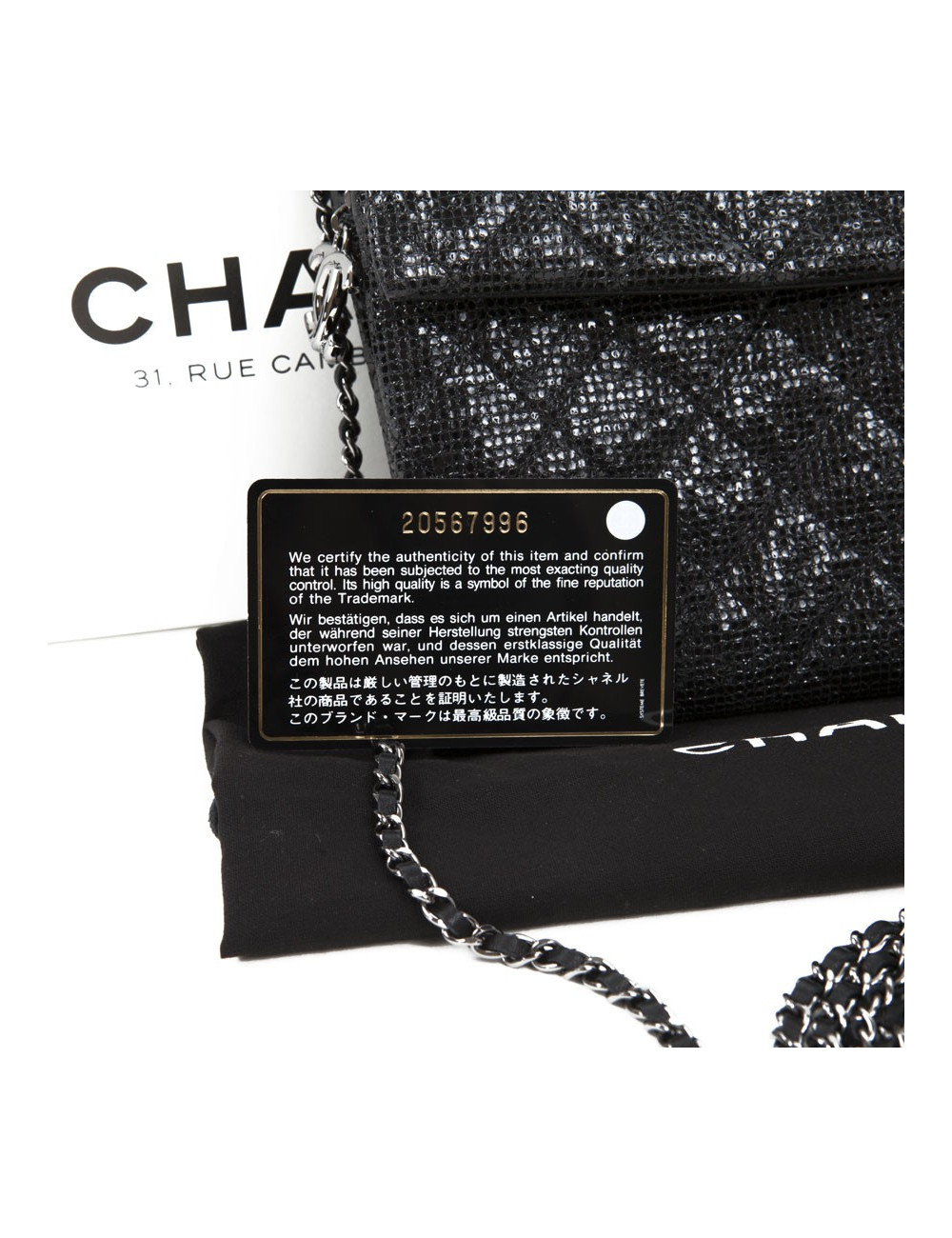 CHANEL quilted shiny black leather pouch