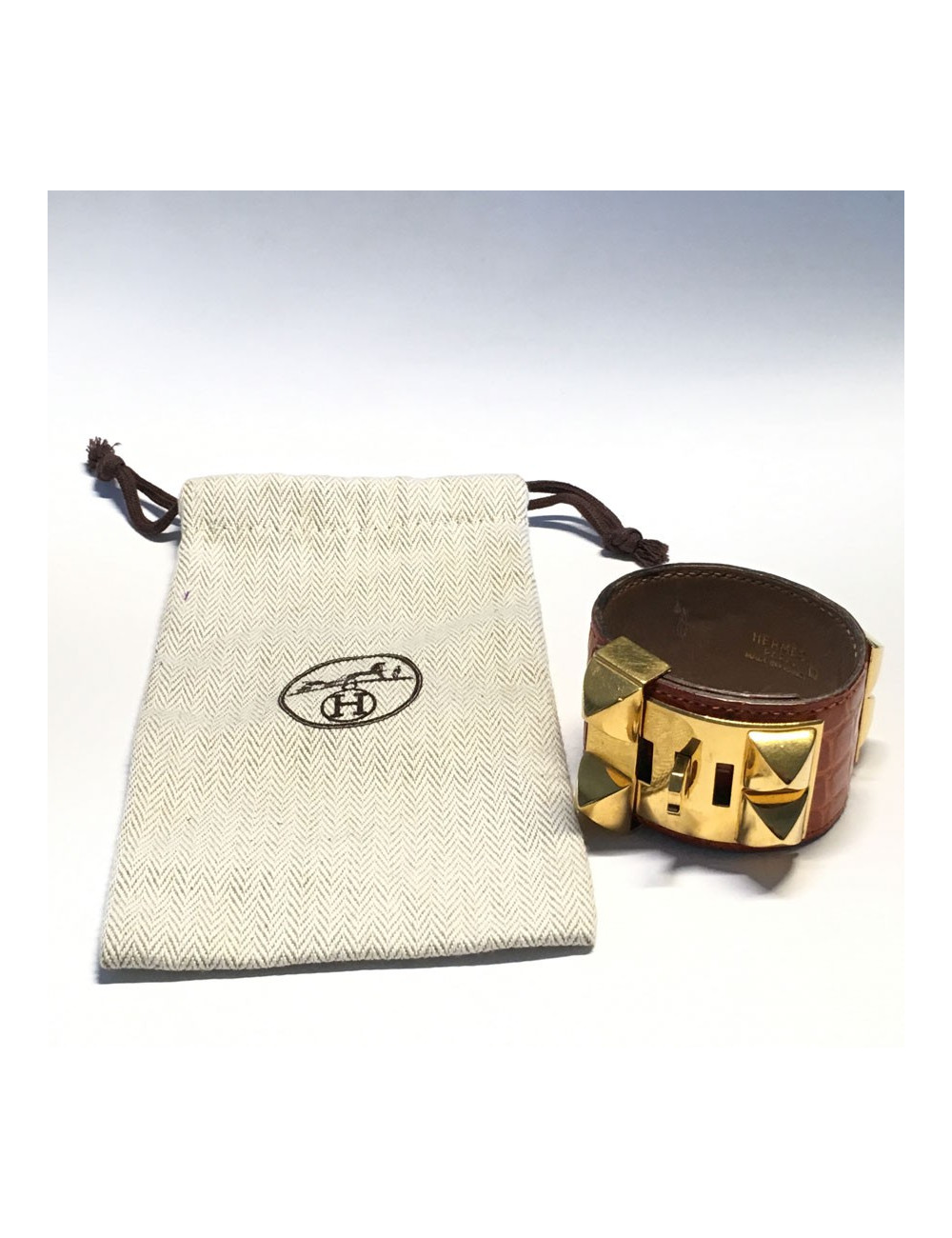 HERMES Medor cuff in orange leather and gold hardware