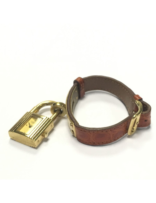 HERMES Kelly watch with ora,ge crocodile bracelet and gilded hardware