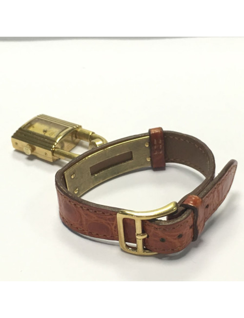 HERMES Kelly watch with ora,ge crocodile bracelet and gilded hardware