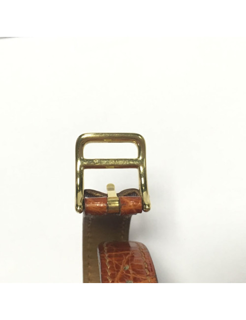 HERMES Kelly watch with ora,ge crocodile bracelet and gilded hardware