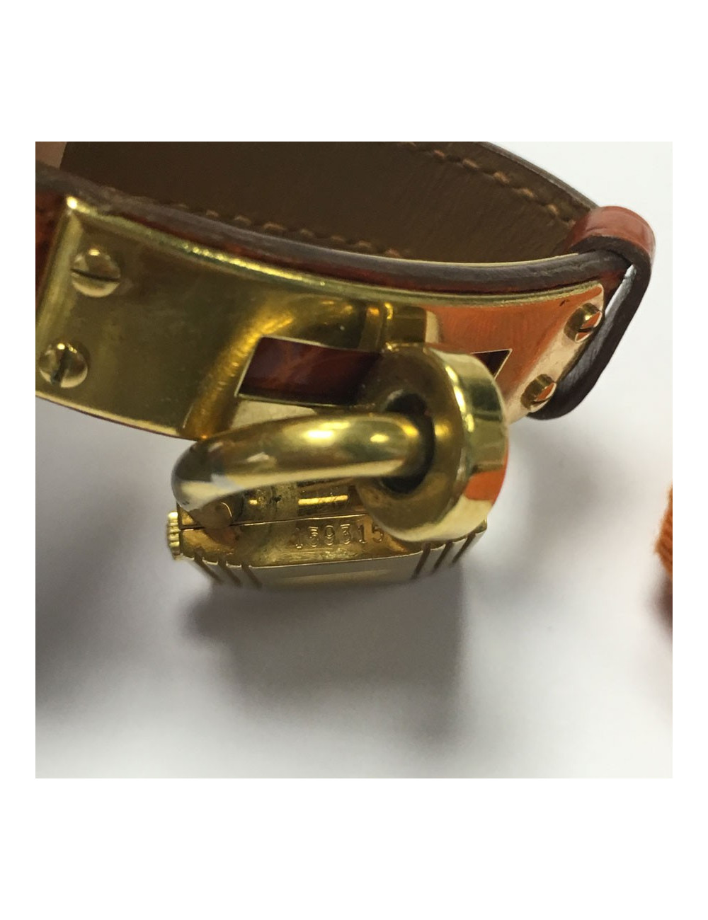 HERMES Kelly watch with ora,ge crocodile bracelet and gilded hardware