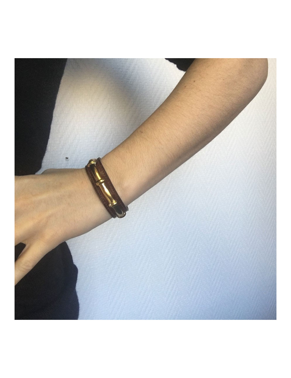 HERMES brown leather bracelet and gold bamboo