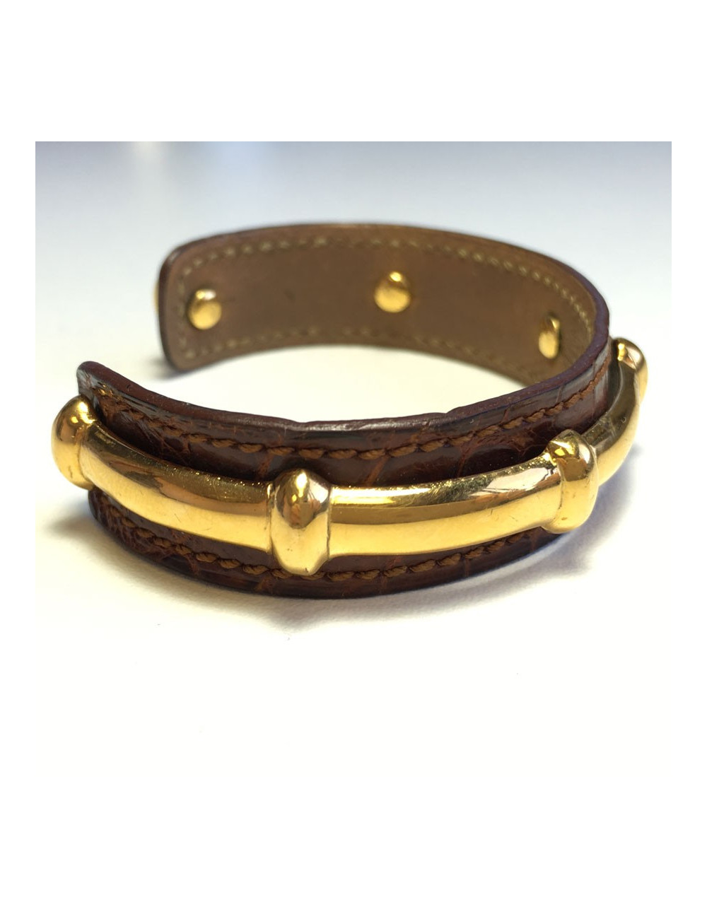 HERMES brown leather bracelet and gold bamboo