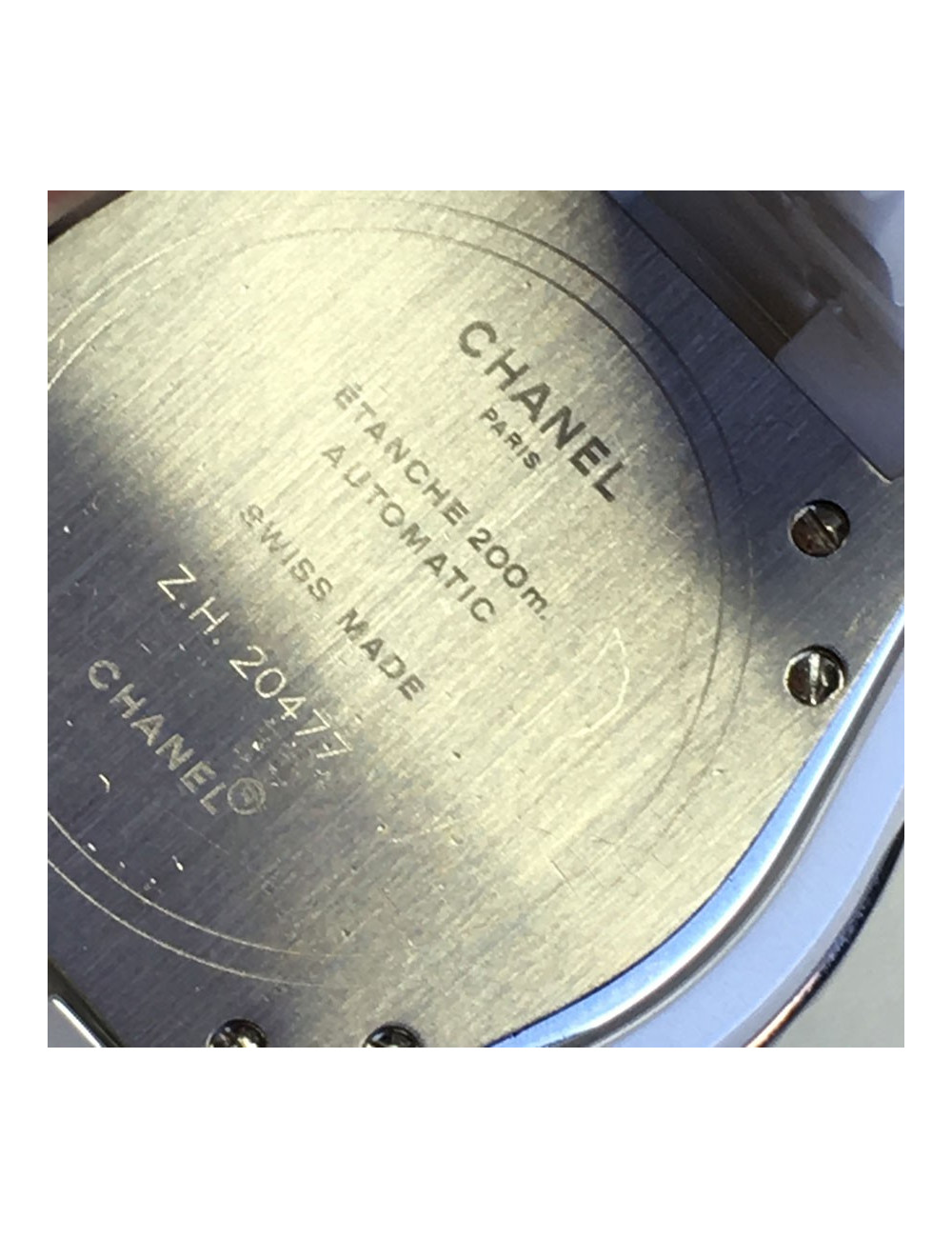 White ceramic CHANEL J12 watch and diamonds