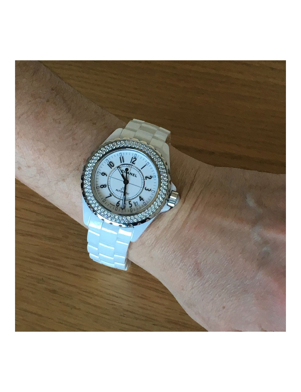 White ceramic CHANEL J12 watch and diamonds