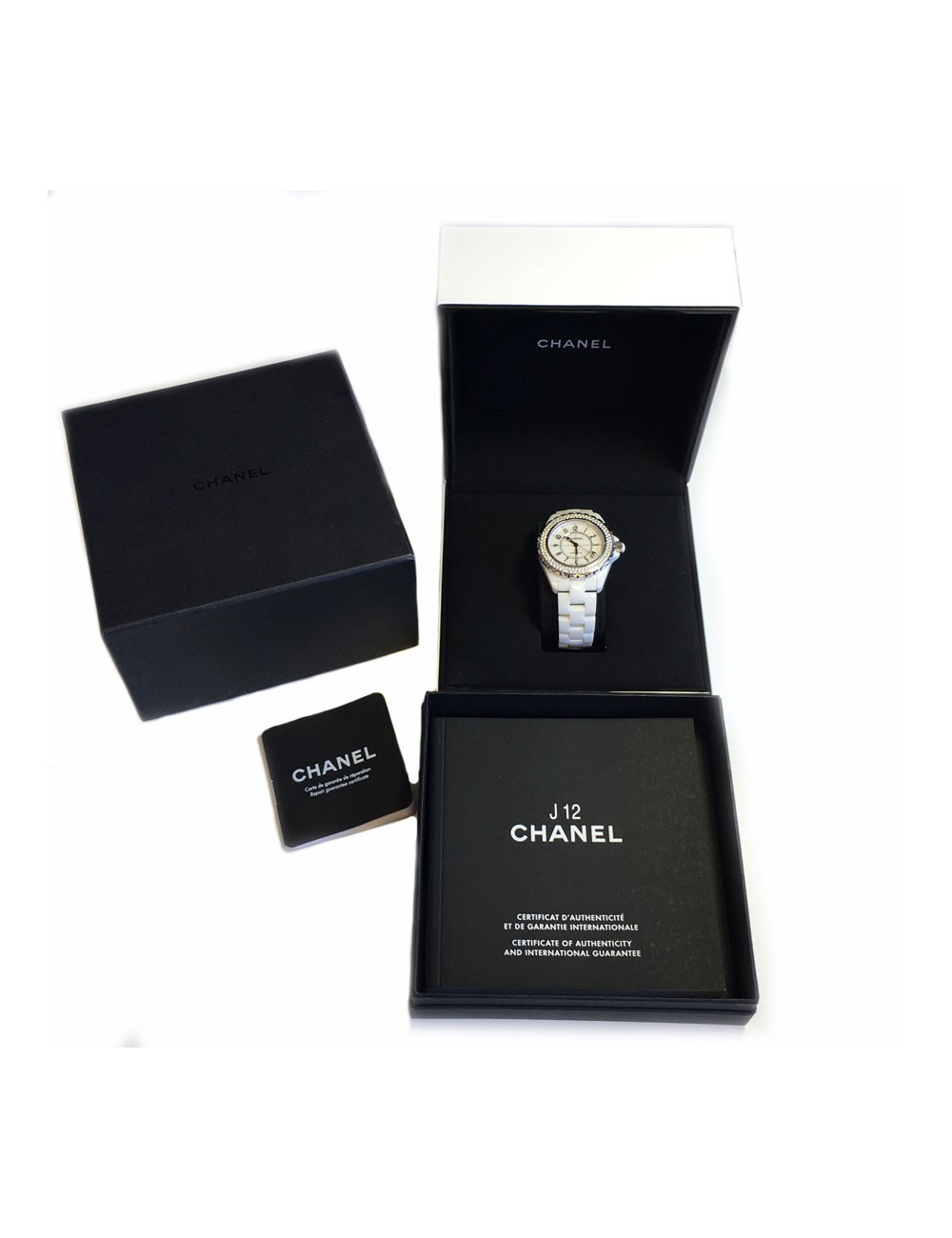 White ceramic CHANEL J12 watch and diamonds
