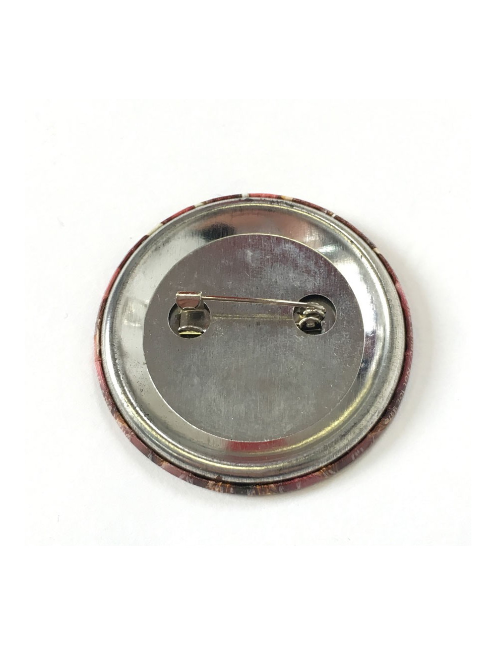 Pin’s CHANEL rond en métal 