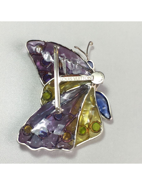 Broche LOUIS VUITTON papillon en pâte de verre multicolore et métal argenté