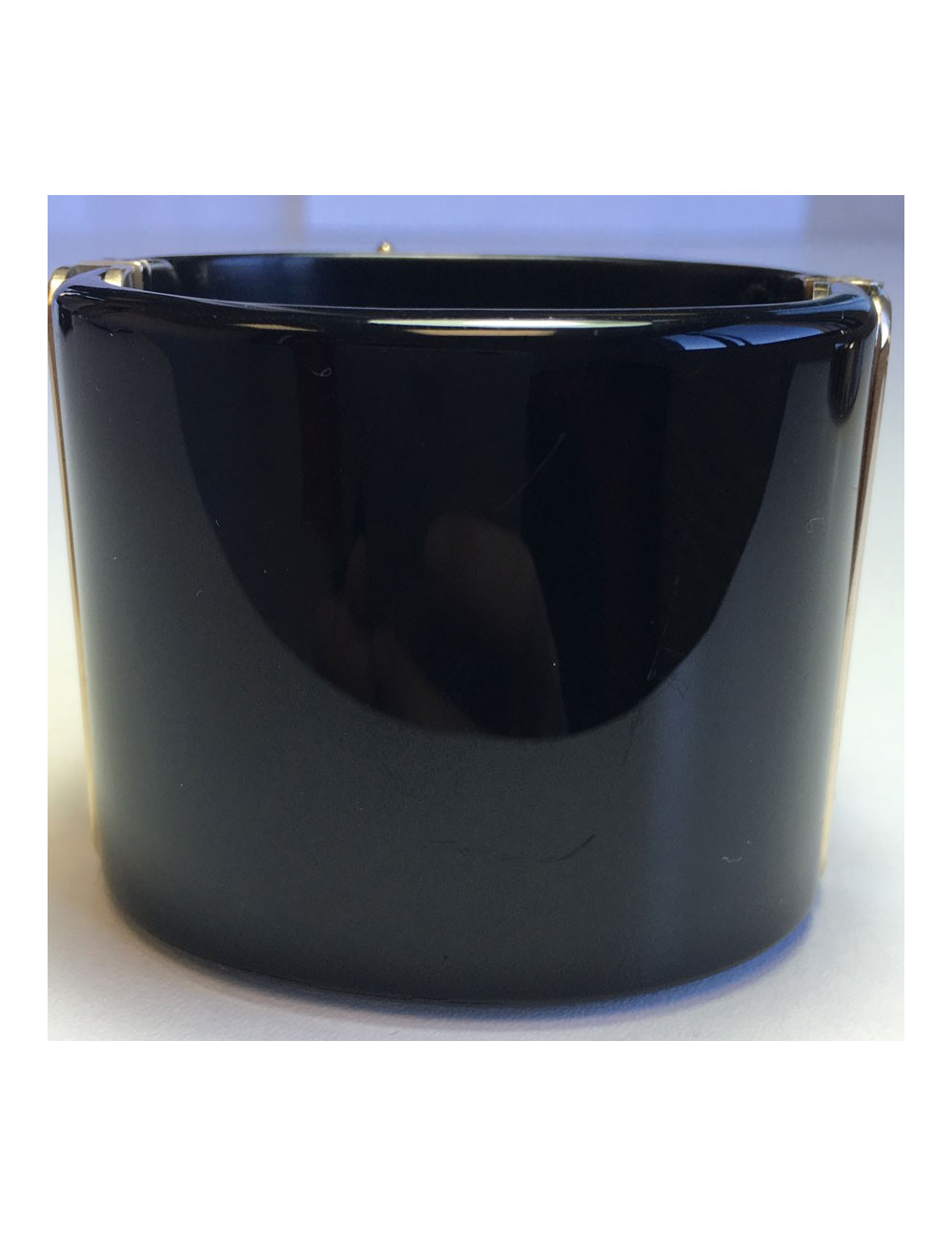 CHANEL cuff in black resin and flower in gold metal and transparent resin