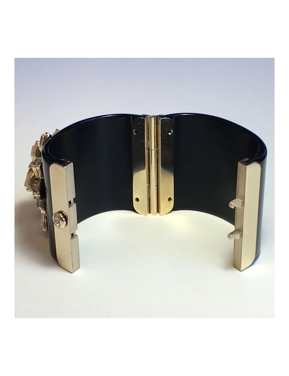 CHANEL cuff in black resin and flower in gold metal and transparent resin