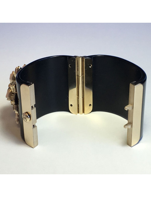 CHANEL cuff in black resin and flower in gold metal and transparent resin