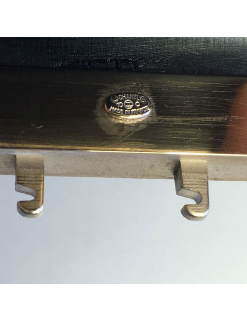 CHANEL cuff in black resin and flower in gold metal and transparent resin