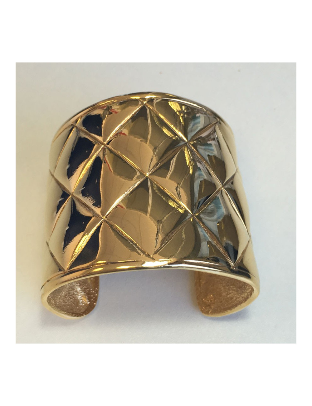 CHANEL Couture cuff bracelet with a quilted effect in gilded metal