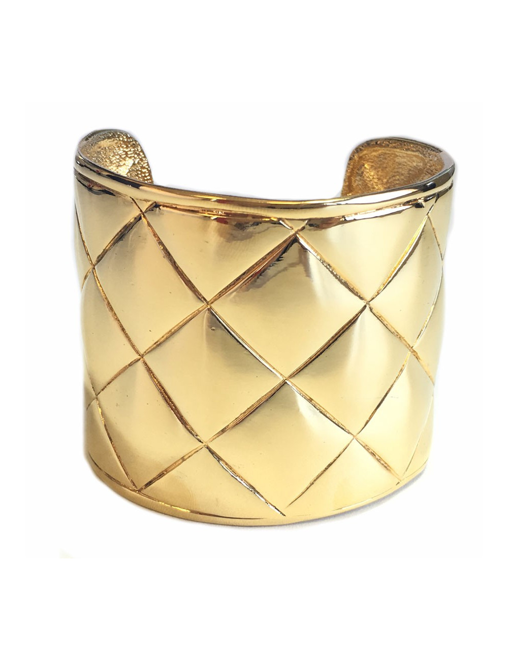 CHANEL Couture cuff bracelet with a quilted effect in gilded metal