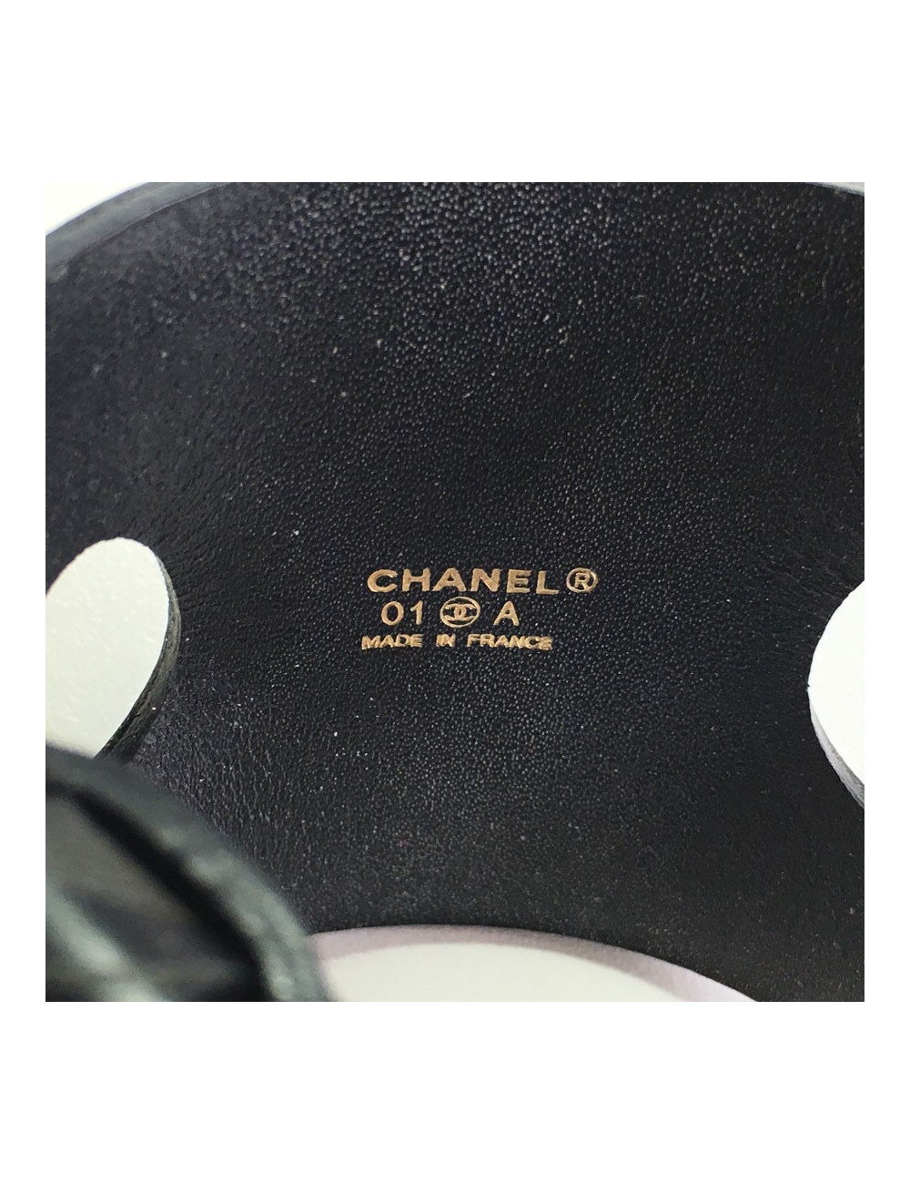 CHANEL "Coco" cuff bracelet in black leather