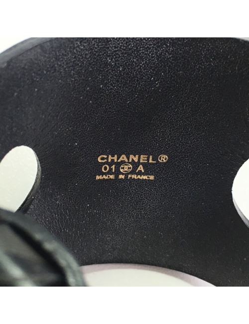 CHANEL "Coco" cuff bracelet in black leather