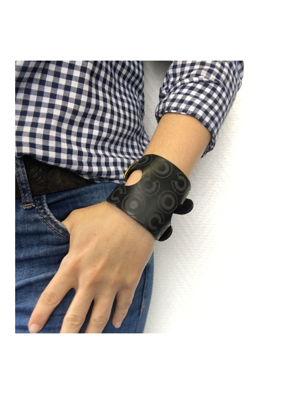 CHANEL "Coco" cuff bracelet in black leather