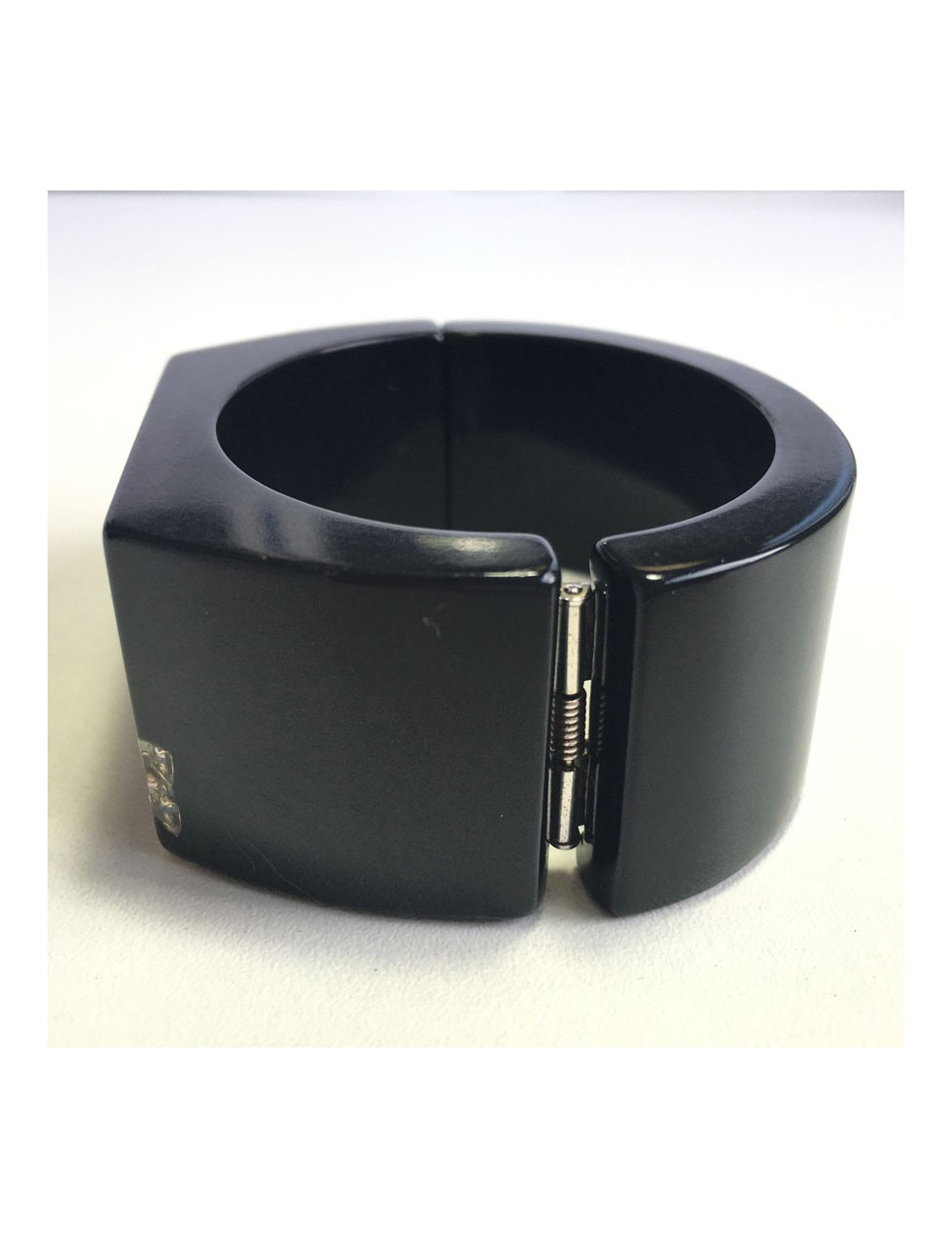 CHANEL cuff in black plastic and inclusion of white rhinestones