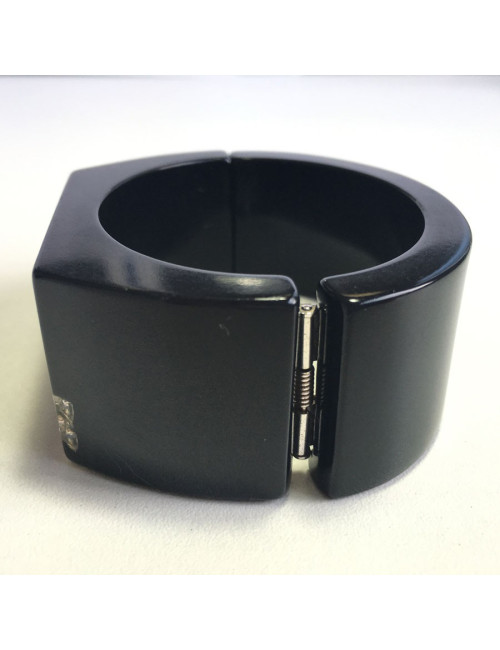 CHANEL cuff in black plastic and inclusion of white rhinestones