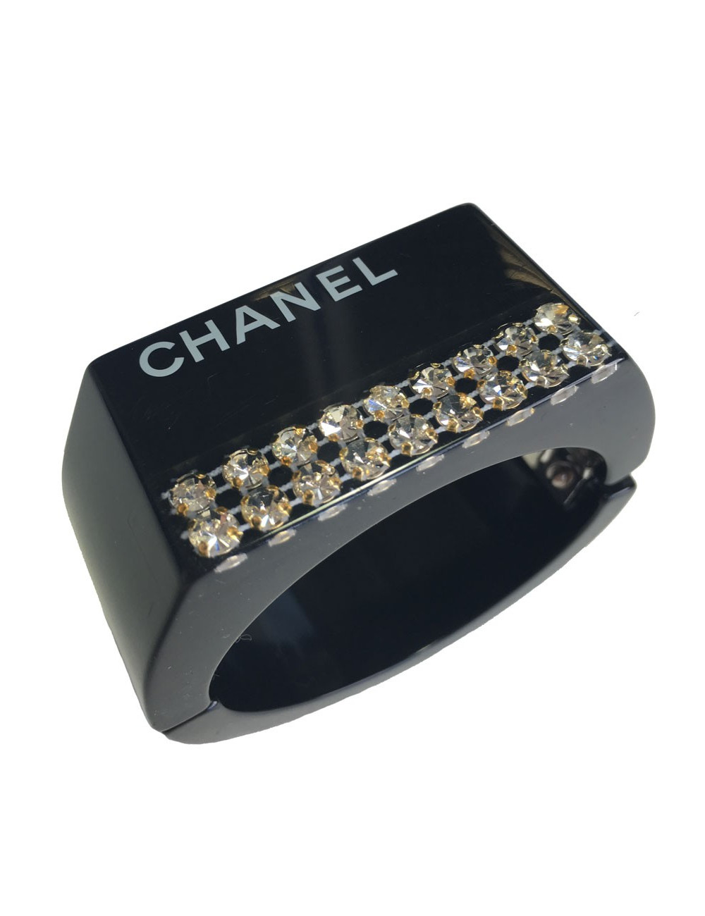 CHANEL cuff in black plastic and inclusion of white rhinestones