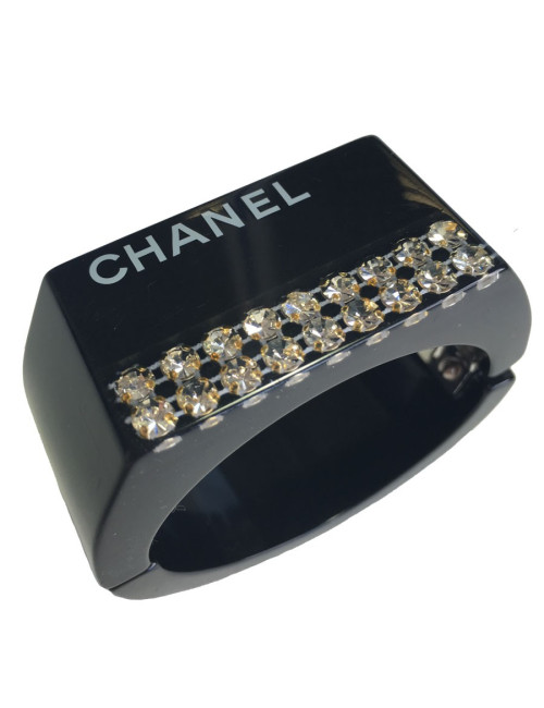 CHANEL cuff in black plastic and inclusion of white rhinestones