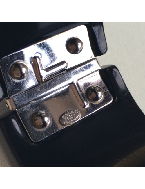 CHANEL cuff in black plastic and inclusion of white rhinestones