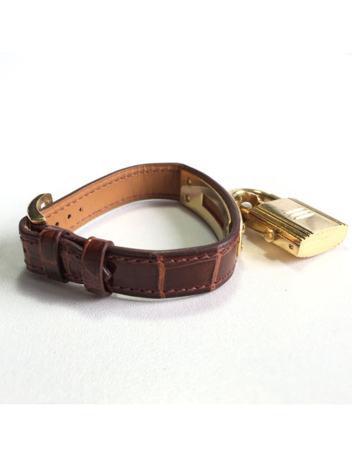 Montre Kelly HERMES bracelet en alligator marron et bijouterie plaqué or