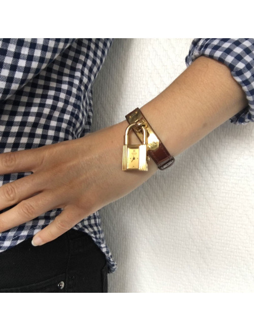 Montre Kelly HERMES bracelet en alligator marron et bijouterie plaqué or