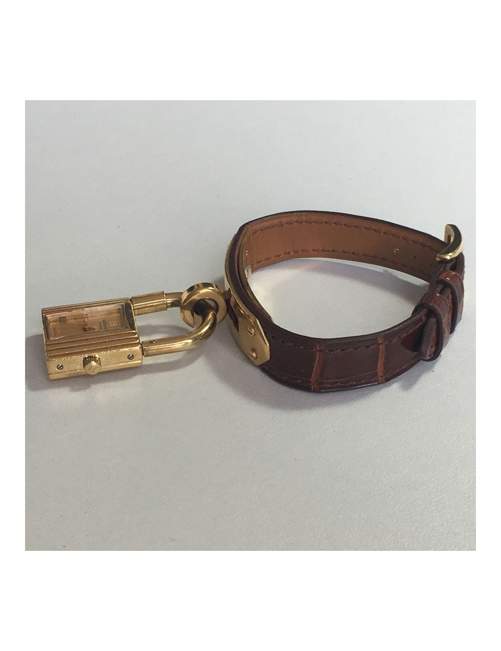 HERMES Kelly watch alligator and gold hardware