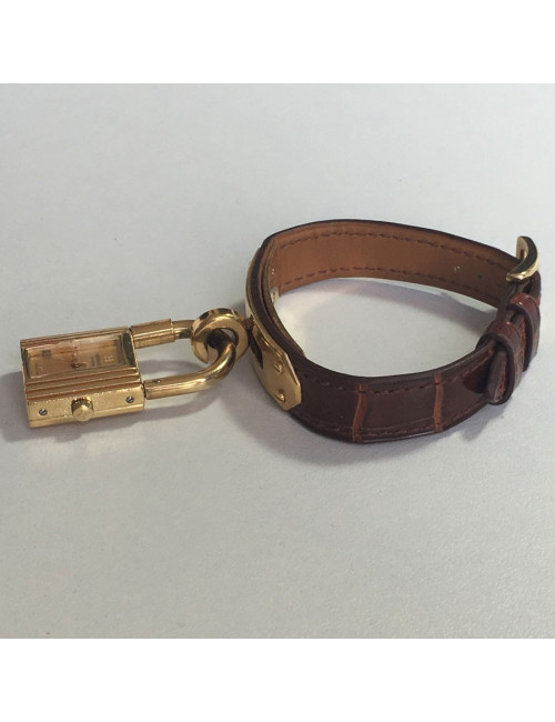 Montre Kelly HERMES bracelet en alligator marron et bijouterie plaqué or